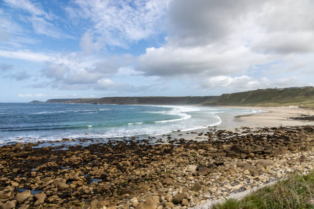 istock A view over Sennen beach on the Cornish coast, with a blue sky overhead 2169631126