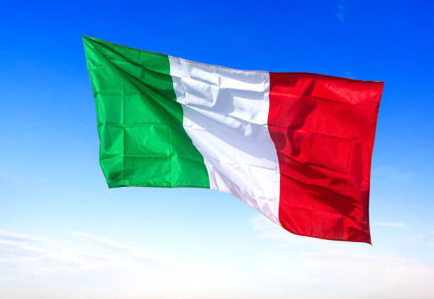 Italian national flag of Italy, Europe ON BLUE SKY background