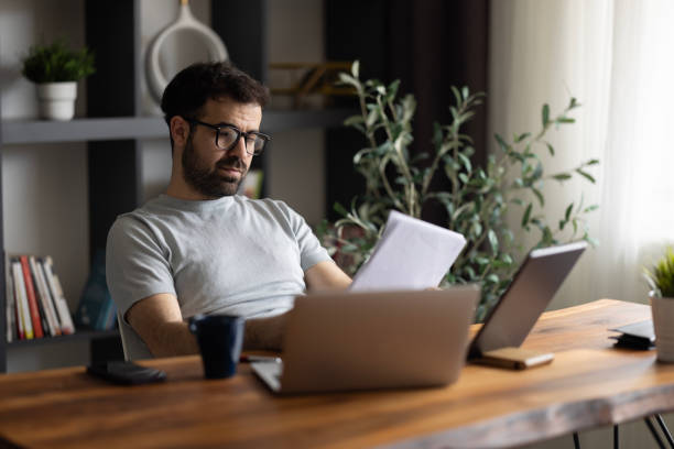istock Concentrated smart 30s young male manager working in modern office. 2169633408