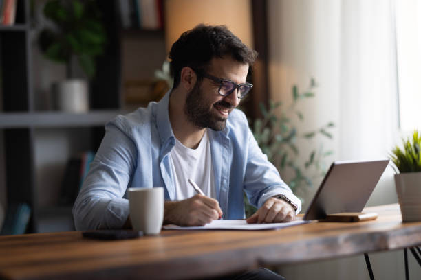 istock Concentrated smart 30s young male manager working in modern office. 2169633555