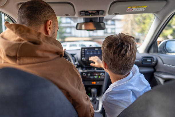 istock Father and son in a car preparing for a road trip 2169642856