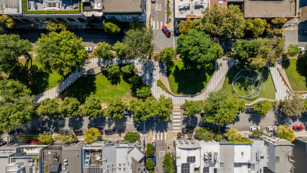 Aerial stock photo of the South Park neighborhood park in the China Basin district in San Francisco. The park revitalization was completed in 2017 and even includes a giant climbing net structure, the entire structure is made to be climbed, hung on, and swung on.