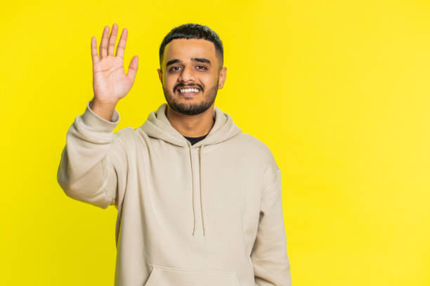 istock Happy man smiling friendly waving hands gesturing hello greeting or goodbye, meeting invitation 2169658543