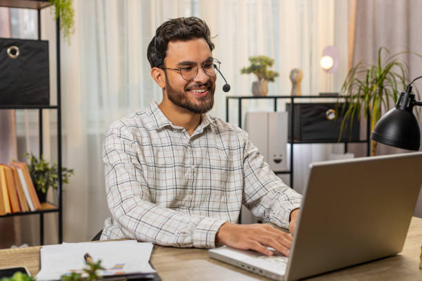 istock Indian businessman wearing headset freelance worker call center or support service operator helpline 2169658650