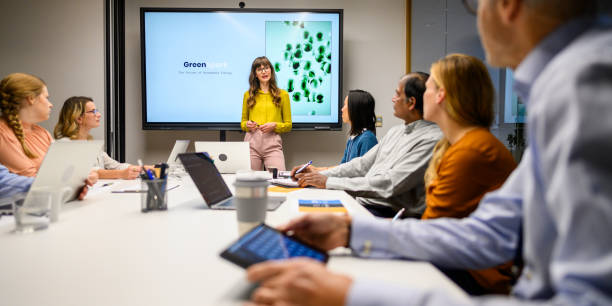 istock Diverse Team Engages in Strategic Discussion at Corporate Meeting 2169658731