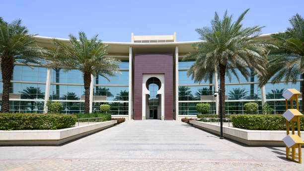 Green landscaped gardens and modern education buildings in Riyadh.