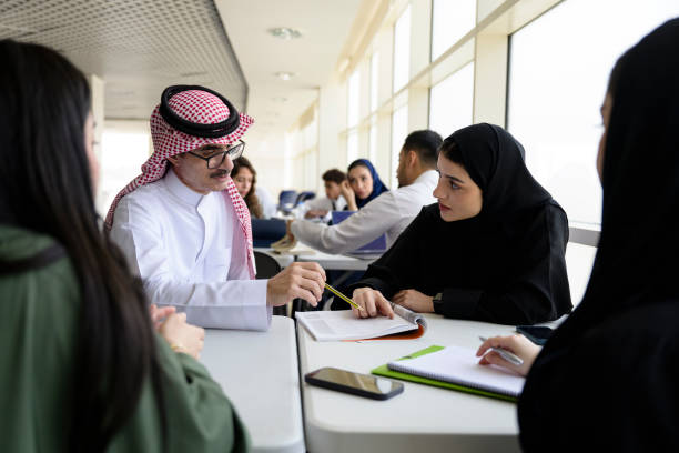 istock Riyadh university students receiving assistance from teacher 2169658873