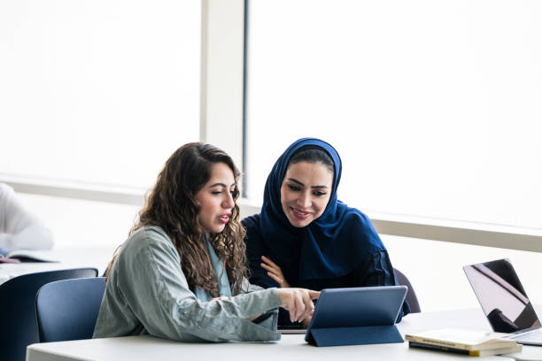 istock Female Saudi educator working with university student 2169658887