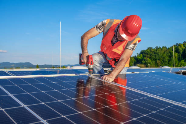 istock Mid Adult Technician Installing Solar Panels 2169659039