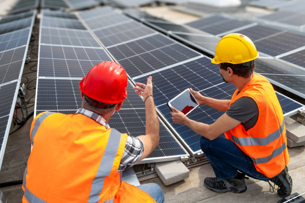 istock Engineers with Digital Tablet at Solar Power Plant Installation 2169659045