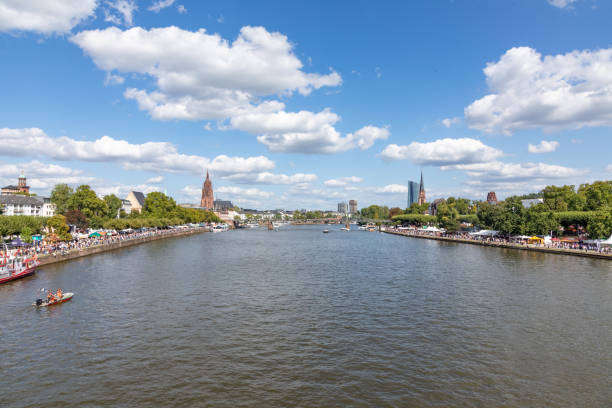 Frankfurt, Germany - August 25, 2024: view to modern skyscraper downtown frankfurt, seen from pedestrian bridge eiserner steg - iron footpath.