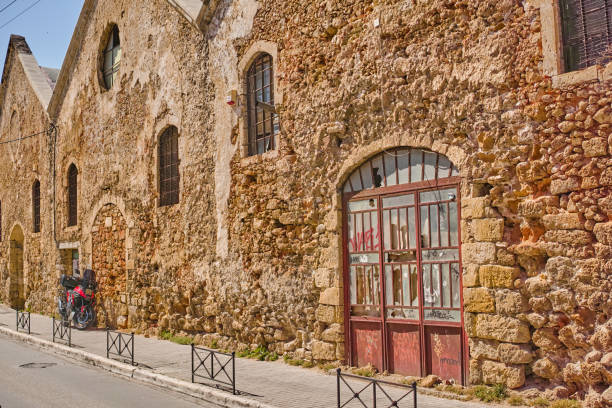 An old, ancient wall of an abandoned building in Chania, Crete, Greece.  Useful as background.