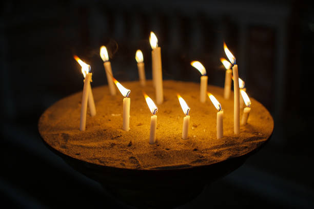 Genova, Italy, June 13, 2023: Candles burning within the Basilica della Santissima Annunziata del Vastato the Catholic Cathedral of Genova