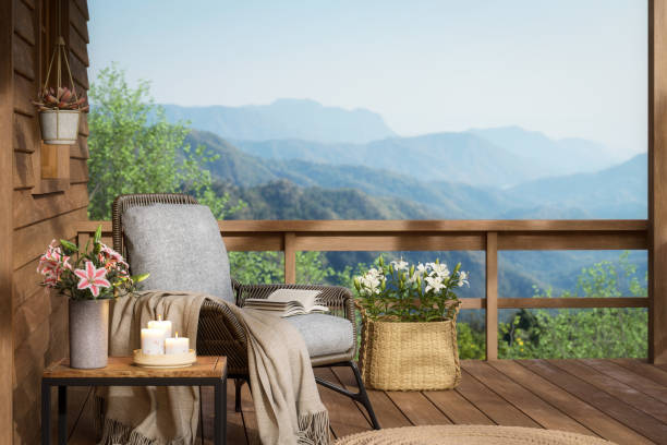 Relaxing corner on the balcony of a wooden house with mountain 3d render Relaxing corner on the balcony of a wooden house with mountain 3d render, Decorated with fabric chair and flower in vase There are wooden railing overlooking the nature luxury-villa-view stock pictures, royalty-free photos & images