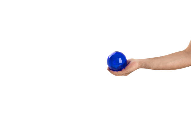 istock Man holding blue Glass Sphere 2169669026