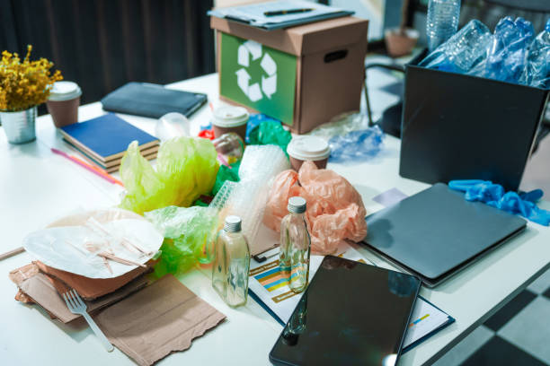 istock Empty desk setup for waste management, featuring bins for separating plastic waste. recycling, sustainability, efficient waste processing, underscoring a commitment to environmental responsibility. 2169669279
