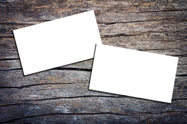istock White bussiness cards on old wooden background 2169672193