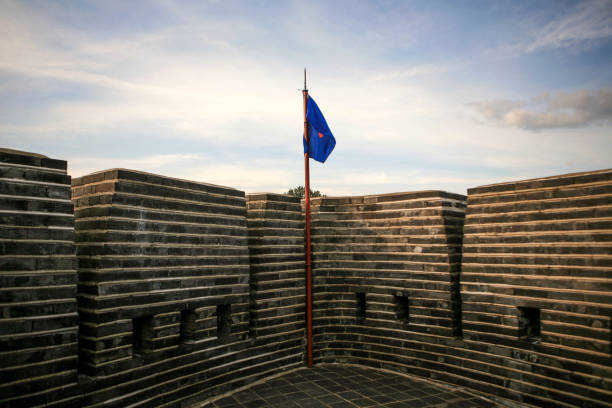 istock flag and defense wall in the stone castle 2169676221