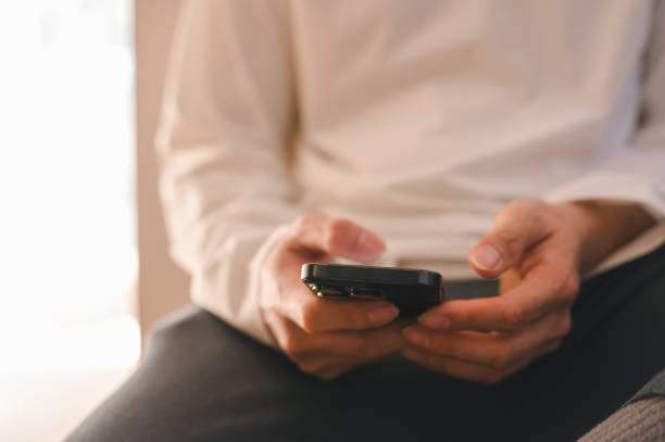 istock Close up man using smart phone, Social media marketing concept. hand using smartphone typing, chatting conversation in chat box icons pop up 2169680210