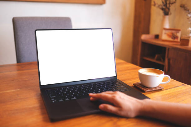 istock Mockup image of a woman using and touching on computer laptop touchpad with blank desktop screen at home 2169682146