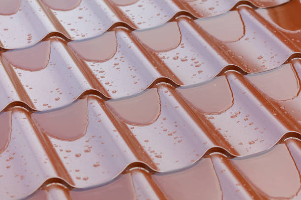 Water on brown metal tile. Background.
