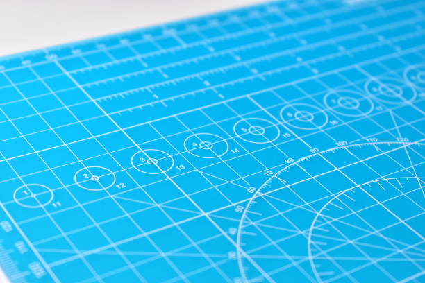 istock blue cutting mat board background with line and scale measure guide pattern for object art design, tool equipment of diy craft work 2169686466