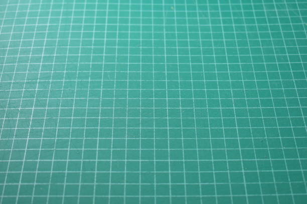 istock green cutting mat board background with line and scale measure guide pattern for object art design, tool equipment of diy craft work 2169686475