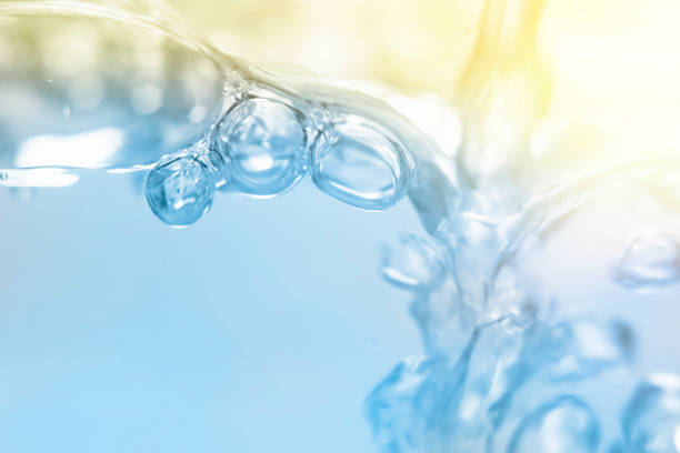 Empty background with foam bubbles in slight blur at high magnification. Background with close-up of soft drink foam in soft focus.