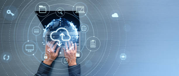 istock Man typing on laptop, cloud service hologram and devices sync. Copy space 2169690971
