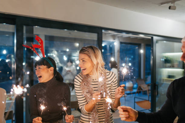 istock Group of people celebrating Christmas together 2169691908