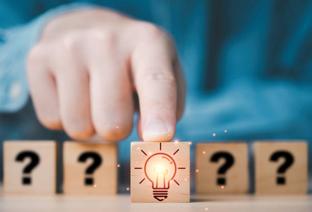 istock Hand touch and pushing glowing lightbulb in front of question mark for creative thinking innovation idea and problem solving solution concept. 2169691962