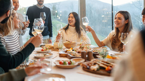 istock Group of people celebrating Thanksgiving together 2169692172