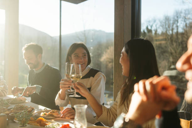 istock Group of people celebrating Thanksgiving together 2169692196