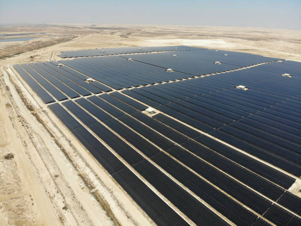 istock Solar panels power station desert aerial view 2169693666