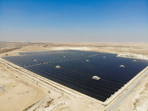 istock Solar panels power station desert aerial view 2169693694