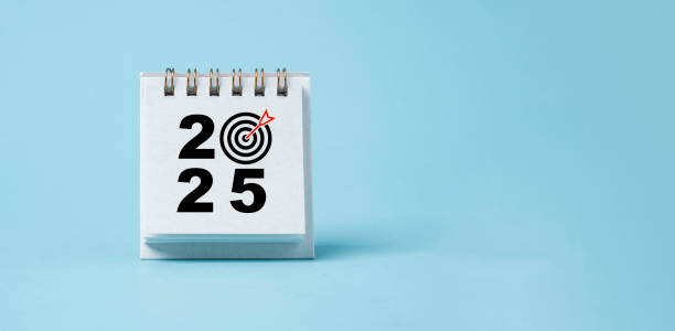 istock 2025 with dartboard arrow on blue calendar for setup business setup objective  target and goal when change to new year concept. 2169695791