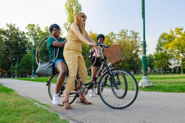Three Young people riding bicycle