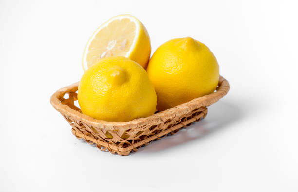 istock Three lemons in a basket on a white background 2169704635