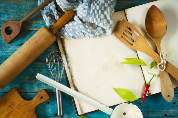 Blank vintage recipe cooking book and old kitchen utensils,free copy space