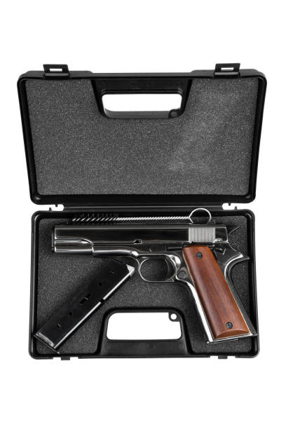 istock A small silver pistol with a wooden handle. Short-barreled weapon. Modern semi-automatic pistol isolate on a white background. 2169709800