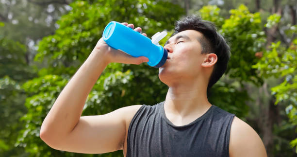 istock asian male drink water park 2169711431