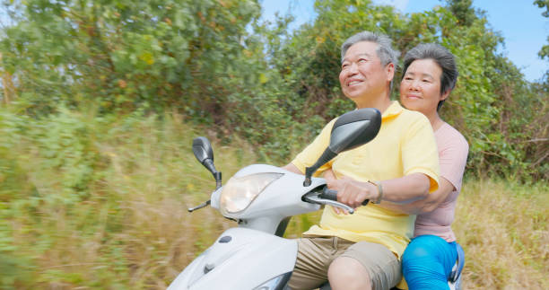 istock elder couple ride motorcycle happy 2169711800