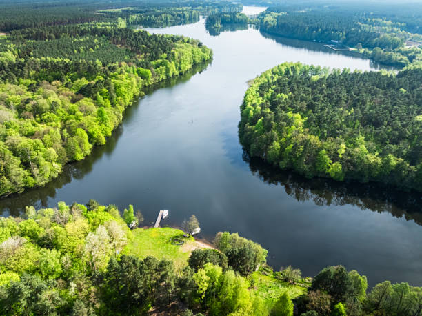 istock Curvy river and forests at spring. Nature in Poland. 2169715874