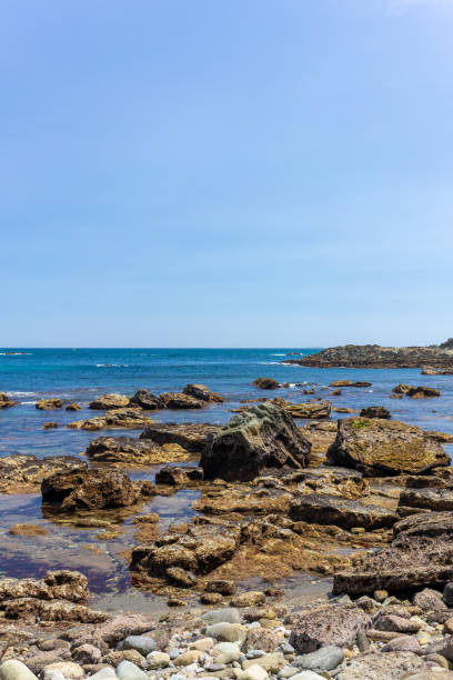 istock Rocky shore and blue sky 2169716645
