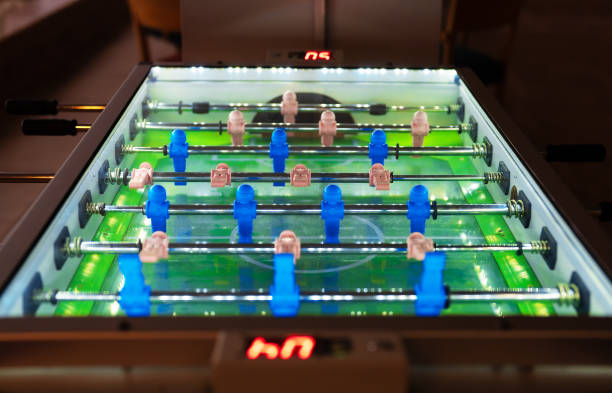 Table football game with white and blue players.
