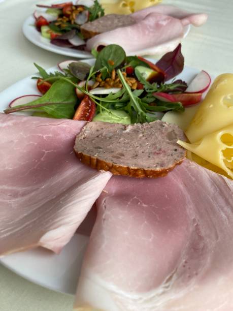 istock breakfast with ham, cheese, bread and salad 2169717471