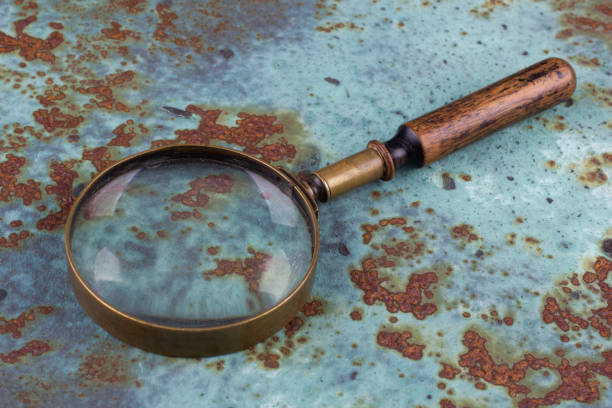 istock magnifying glass on metal rusty background, 2169718198