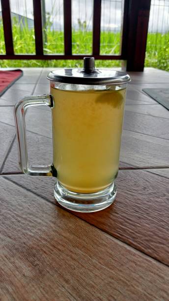 istock Warm orange drink in a simple glass 2169719416