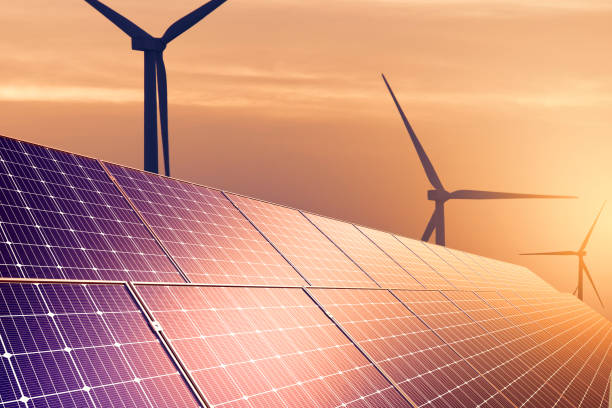 istock solar panel And electric wind turbines at sunset. concept clean energy. Energy supply, wind turbine,eolic turbine, distribution of energy, Powerplant,energy transmission,high voltage supply concept 2169720841