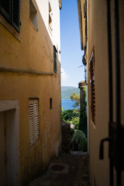 istock Old buildings on a narrow street. 2169726250